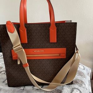 Orange and brown large MK Tote. Bag has a long adjustable strap.